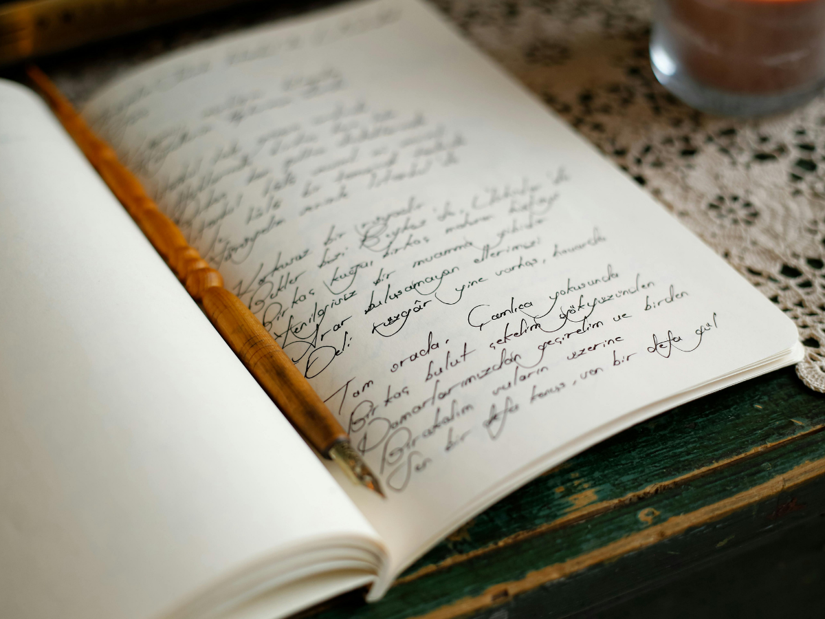 Open journal and coffee in warm natural light